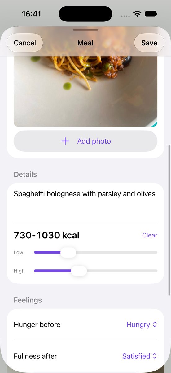The MealSnap meal editor after a photo lands: the meal photograph, the description Spaghetti bolognese with parsley and olives, and the estimated calorie range of 730 to 1030 kcal with its Low and High sliders.